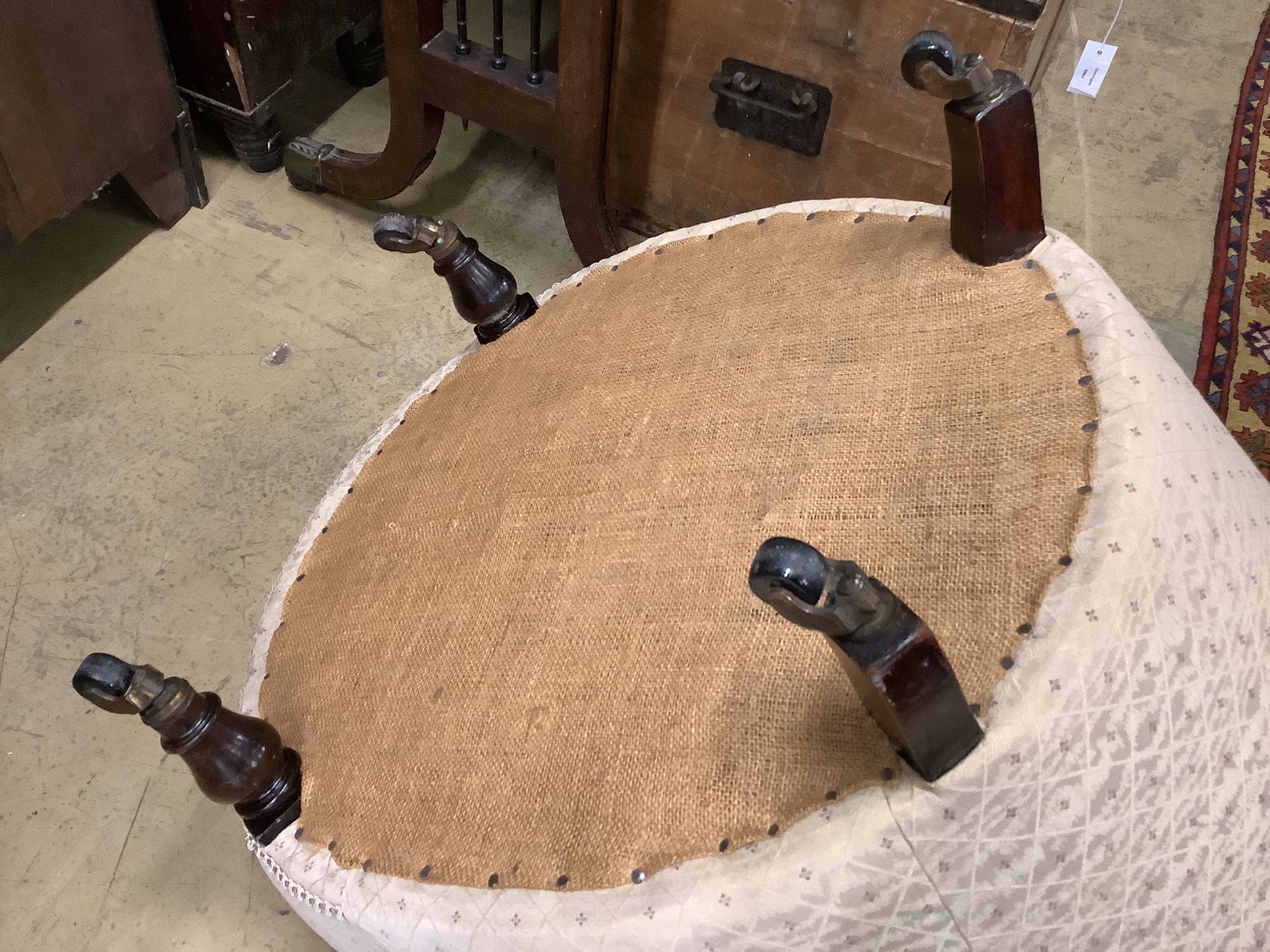 A Victorian upholstered spoon back armchair